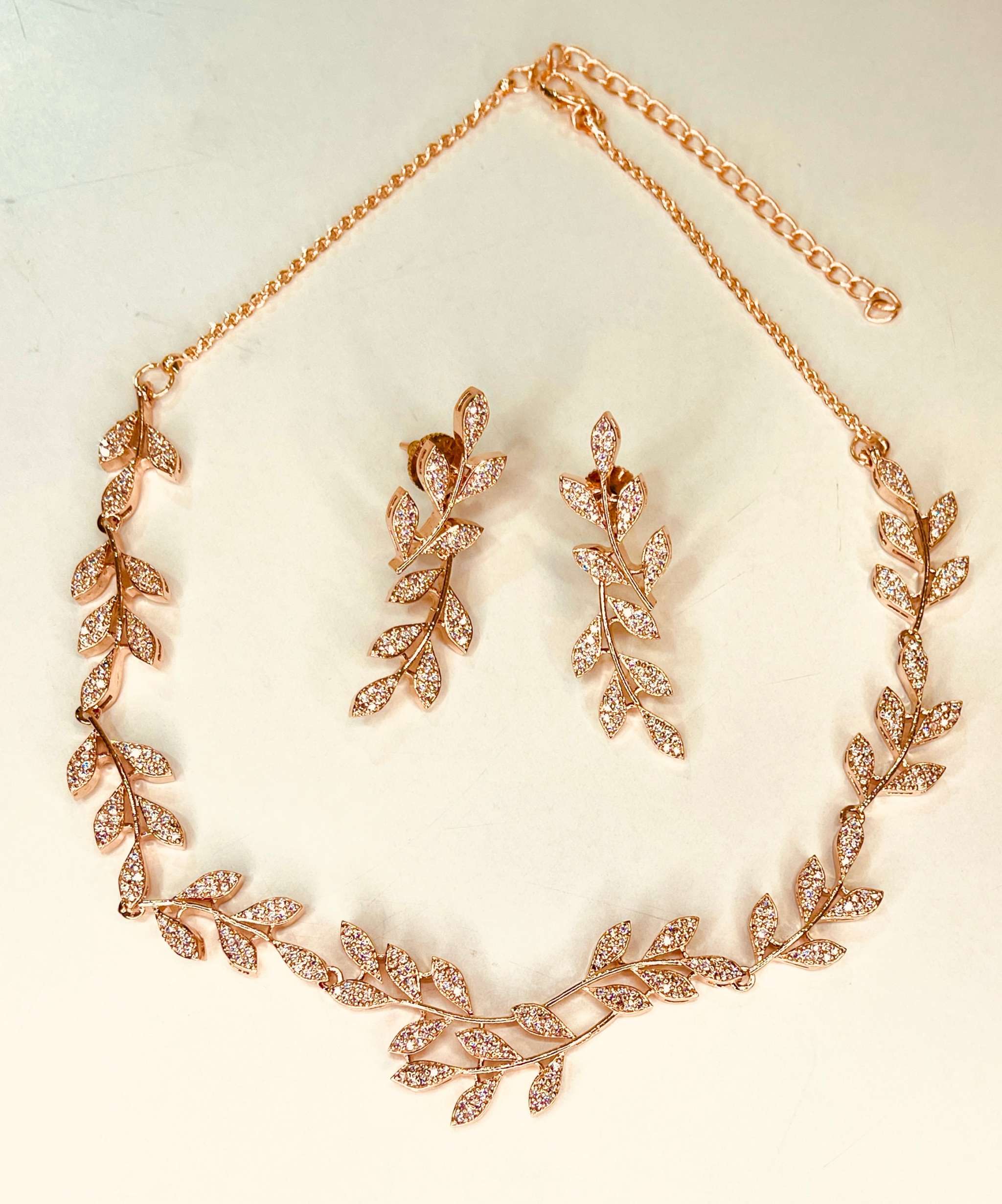 Rosegold Leafy Embrace Necklace Set with delicate leaf motifs and sparkling accents