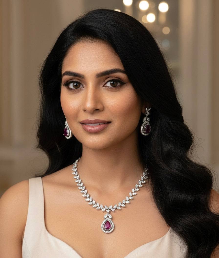 Woman wearing Scarlet Dew Necklace set in silver with bold scarlet accents and dew drop design