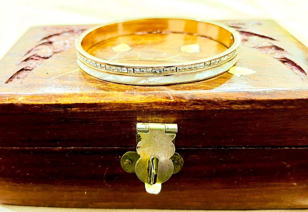 Mother of Pearls bracelet with American diamonds on wooden jewelry box