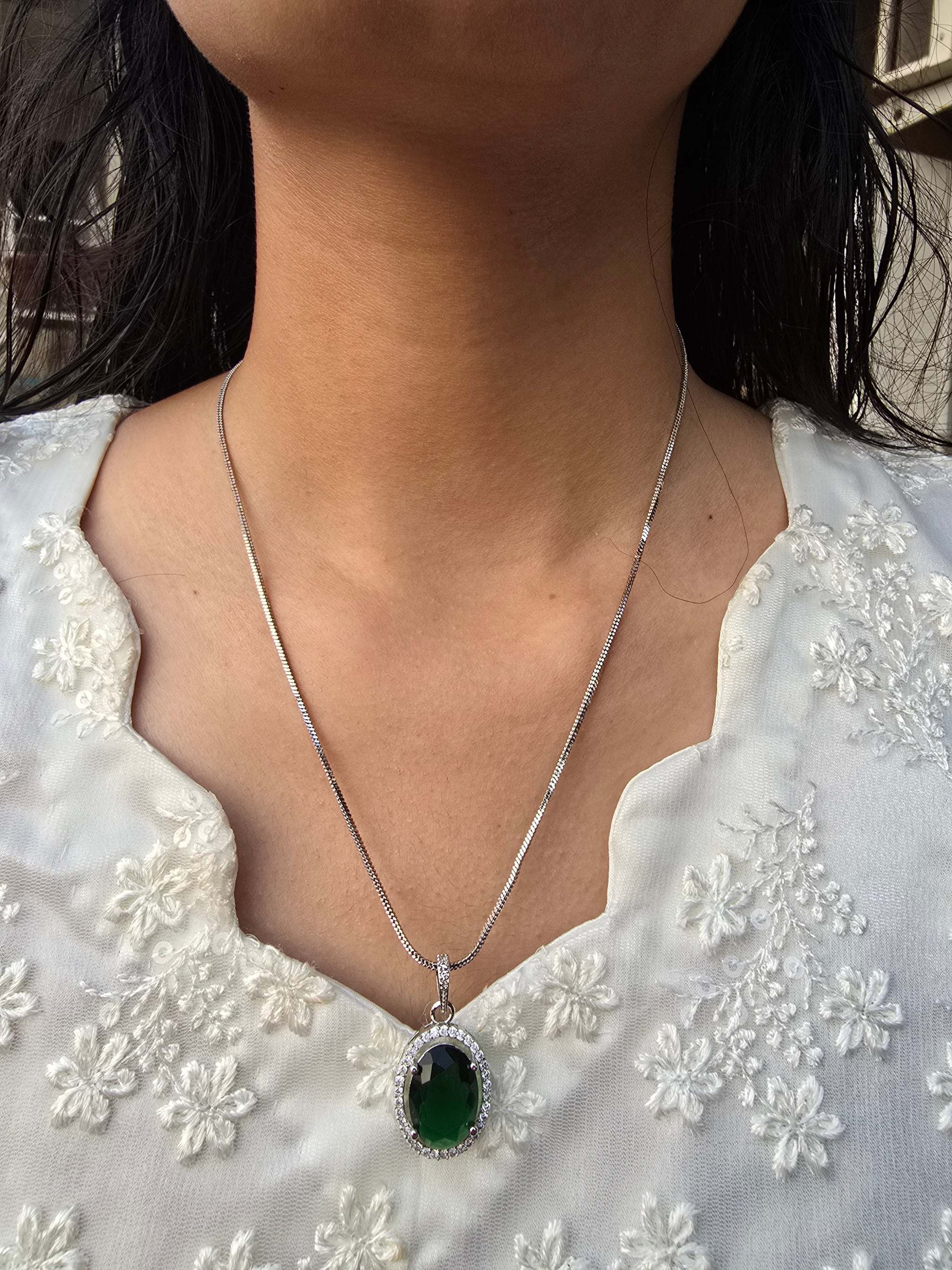 Violet Oval Grand Pendant Set with rich violet gemstone on silver chain worn on neck