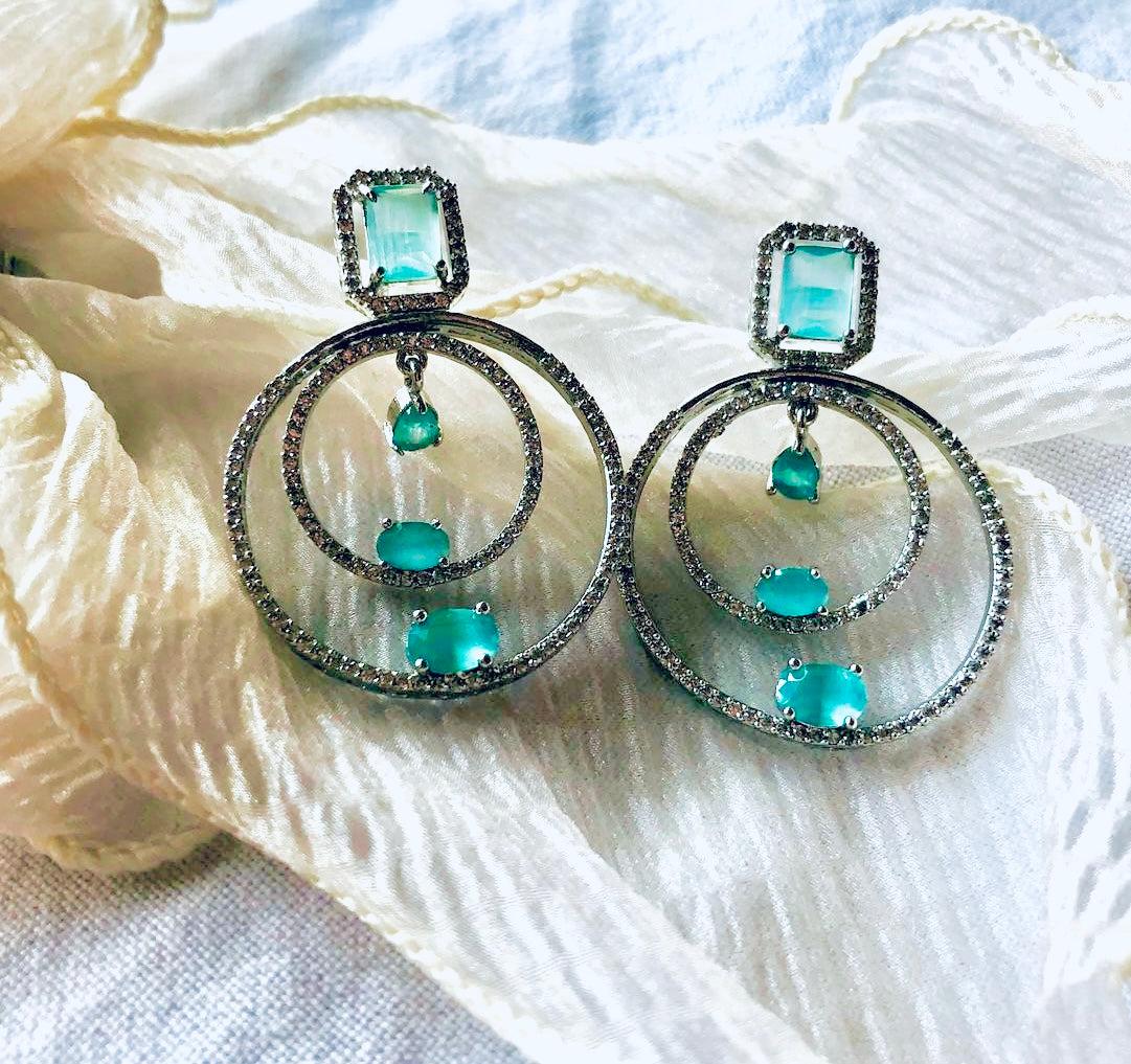 Teal and silver concentric circle earrings with diamond-like sparkle for women