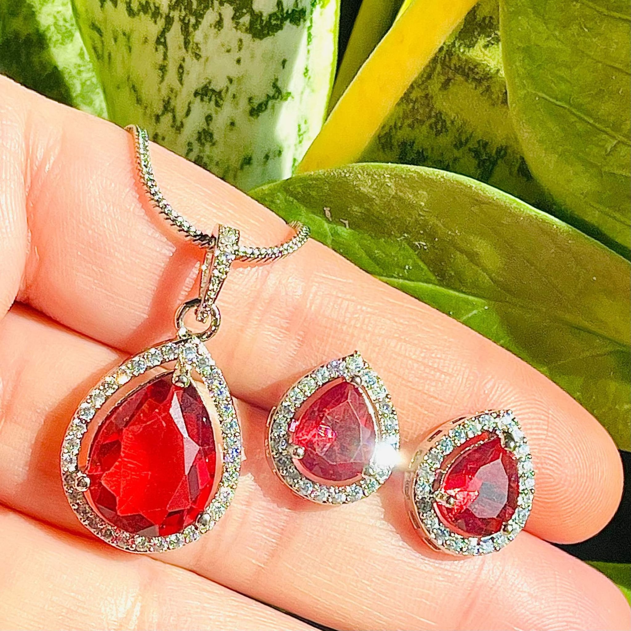 Blazing Red Aurora Drops grand pendant set with red teardrop gemstones and diamond accents
