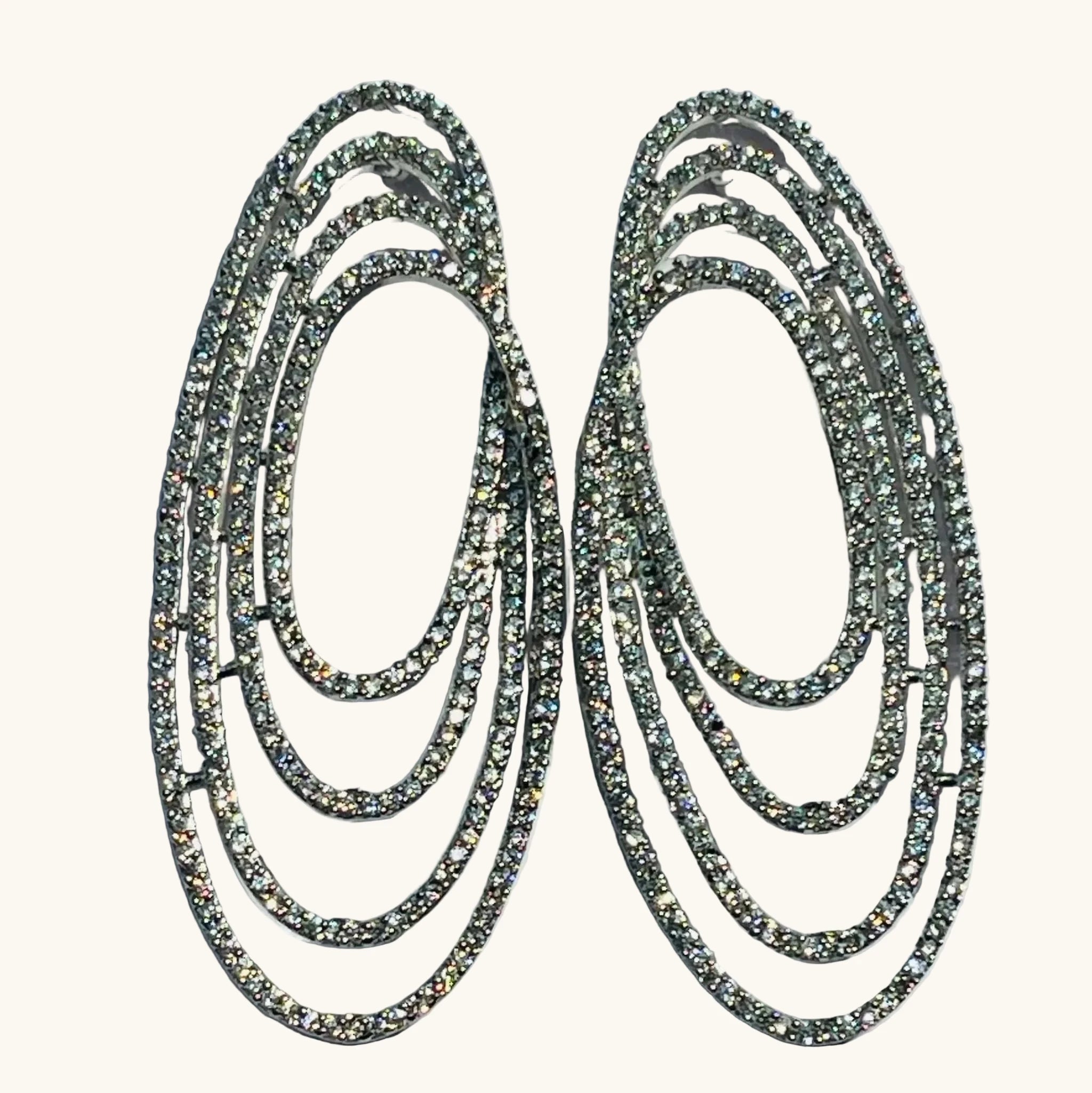 Silver Oval Odyssey Statement Earrings with diamond-look detailing and bold layered design