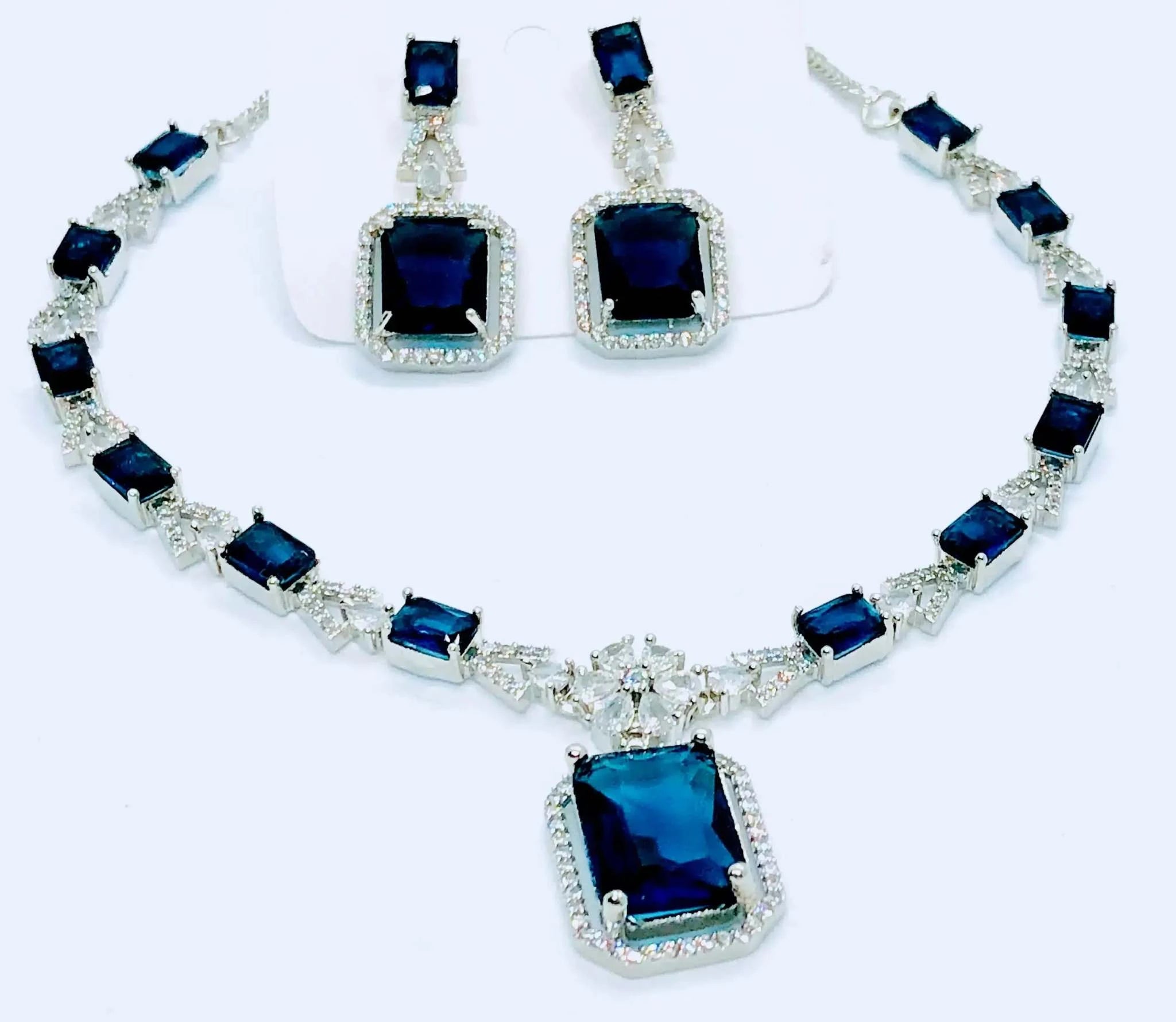 Indigo blue square crystal pendant necklace and matching earrings set with silver accents