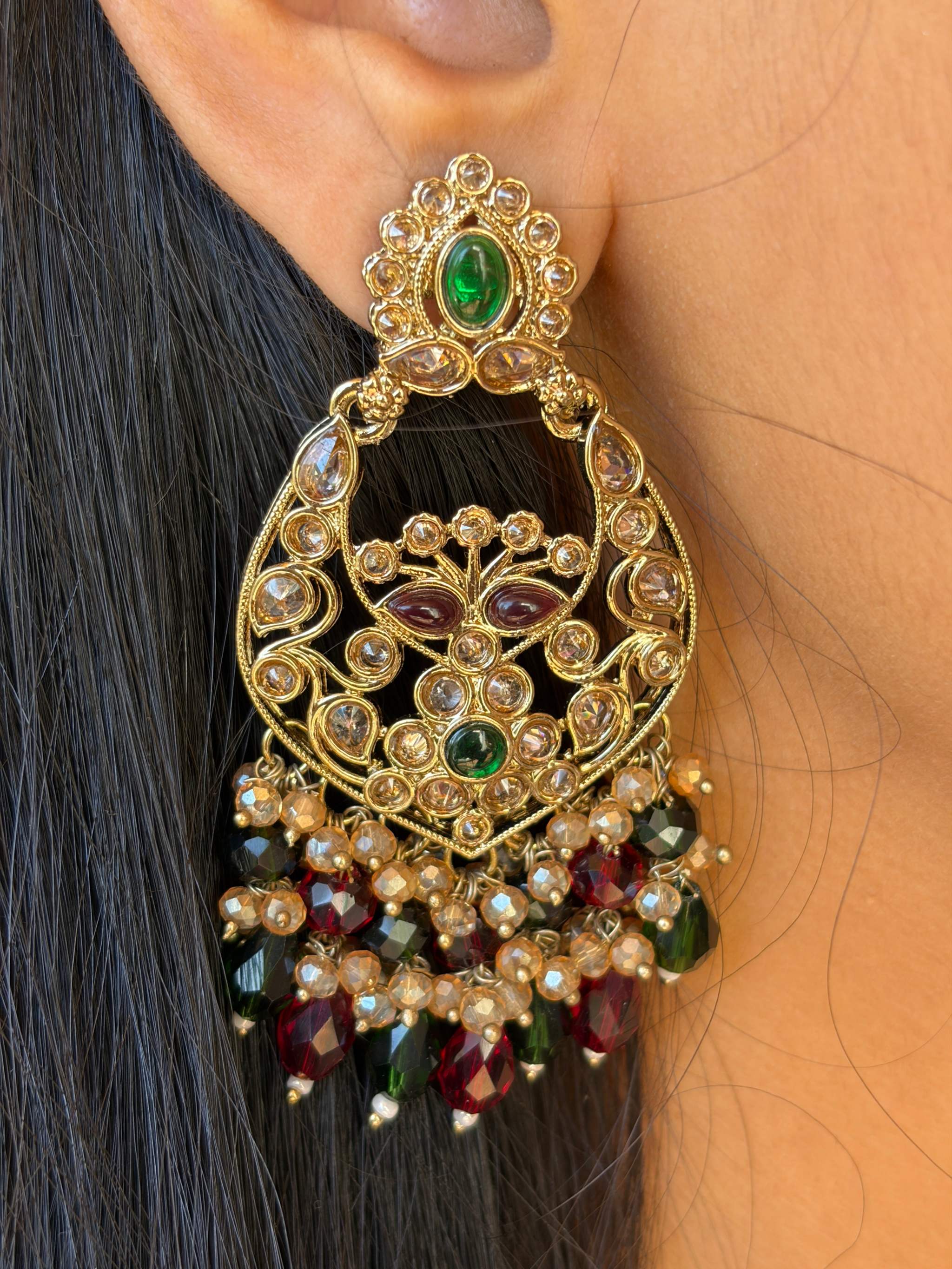 Rangeen Jhalak Chandbali gold-tone crescent earrings with green and red stones and intricate bead detailing