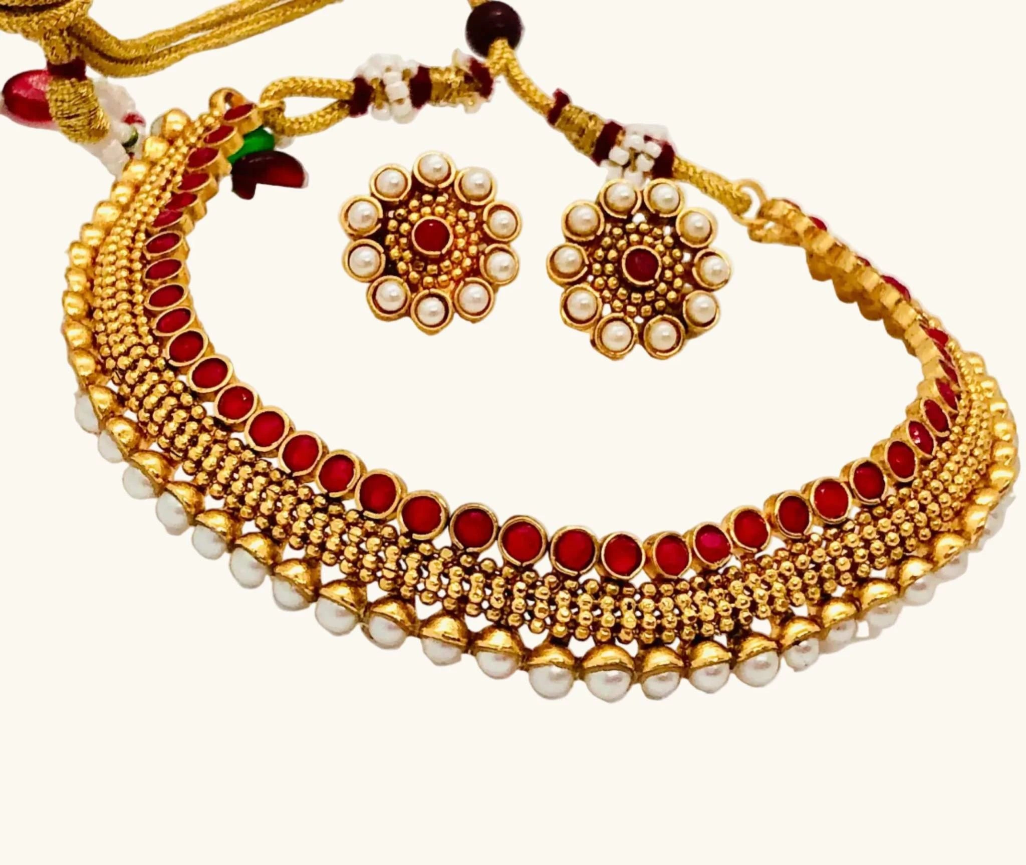 Traditional Pearl and Coral Rajwadi Necklace Set with intricate gold design and matching round pearl-studded earrings