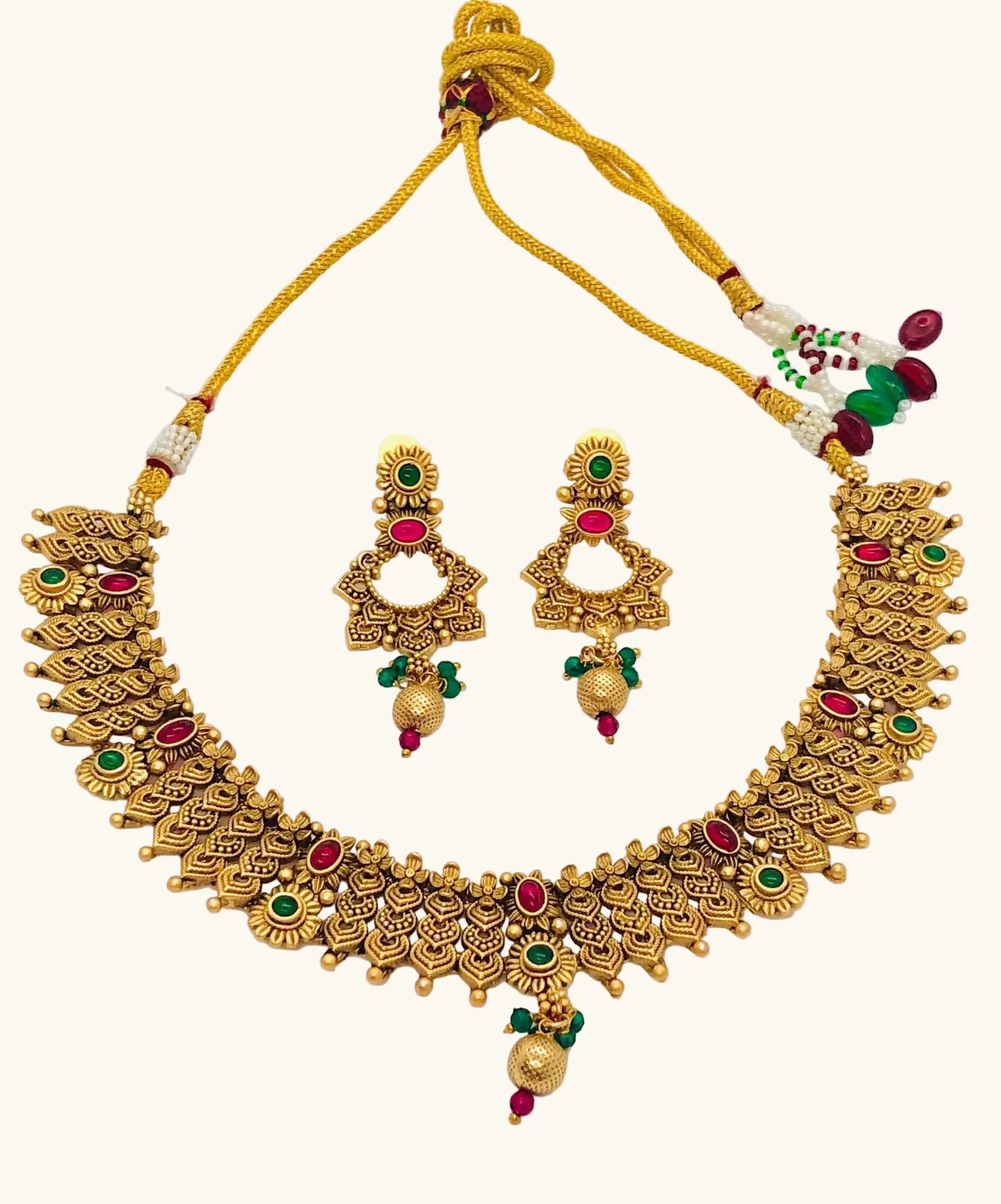 Golden Mehendi necklace set with intricate traditional design and matching designer earrings for weddings and festivals