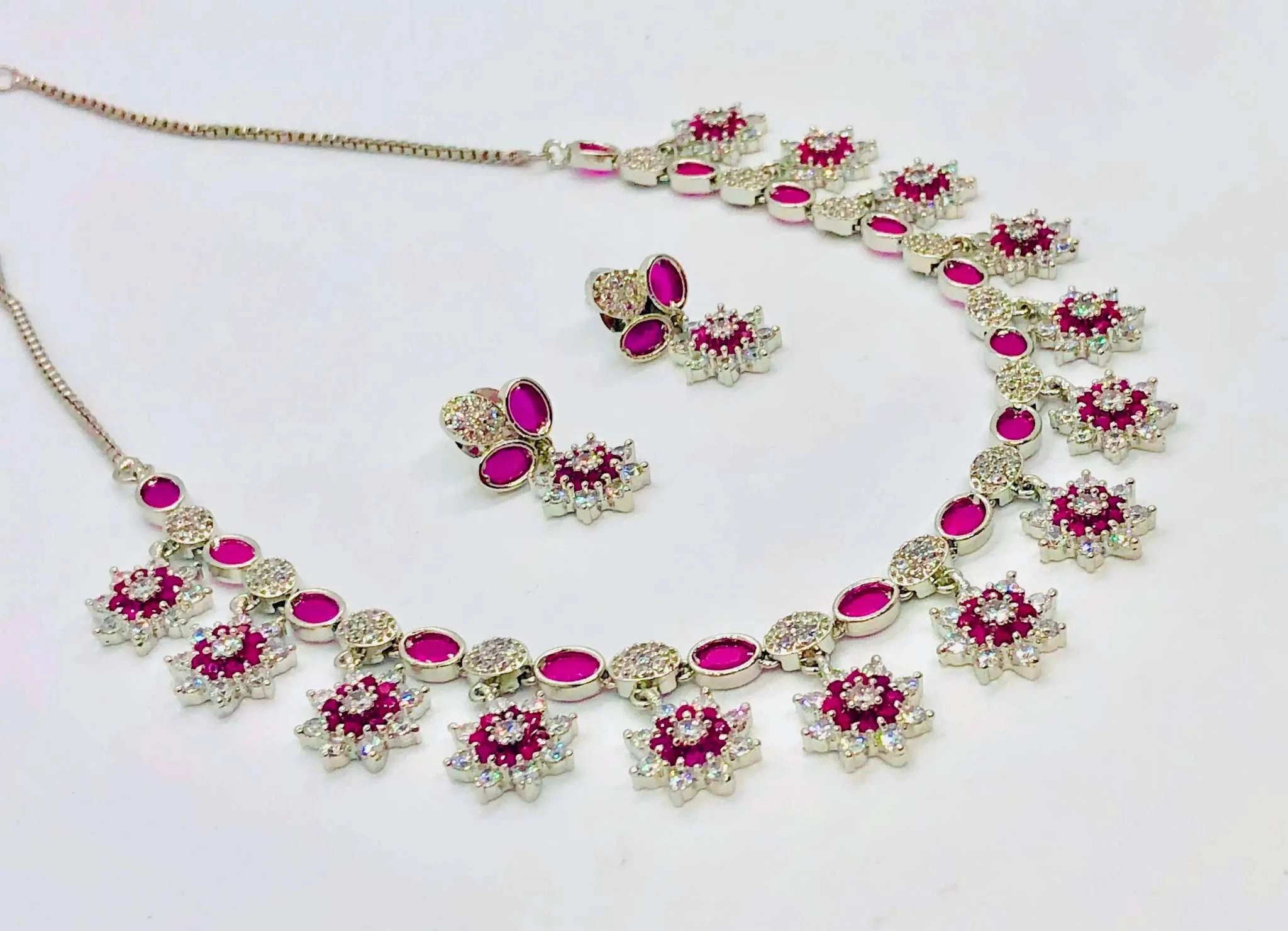 White and Burgundy crystal necklace and earrings set with sparkling floral design for elegant occasions