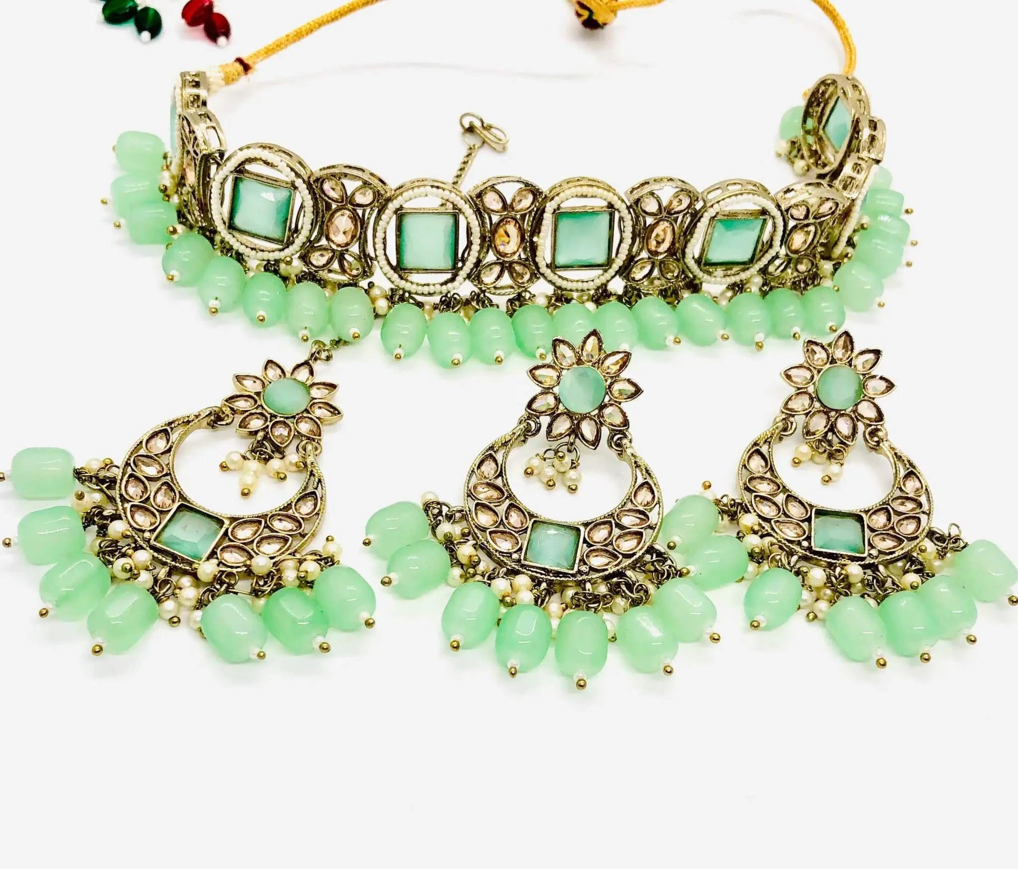 Grape Green Rajawadi Jewelry Set featuring antique finish choker and matching earrings with intricate green stones and beadwork