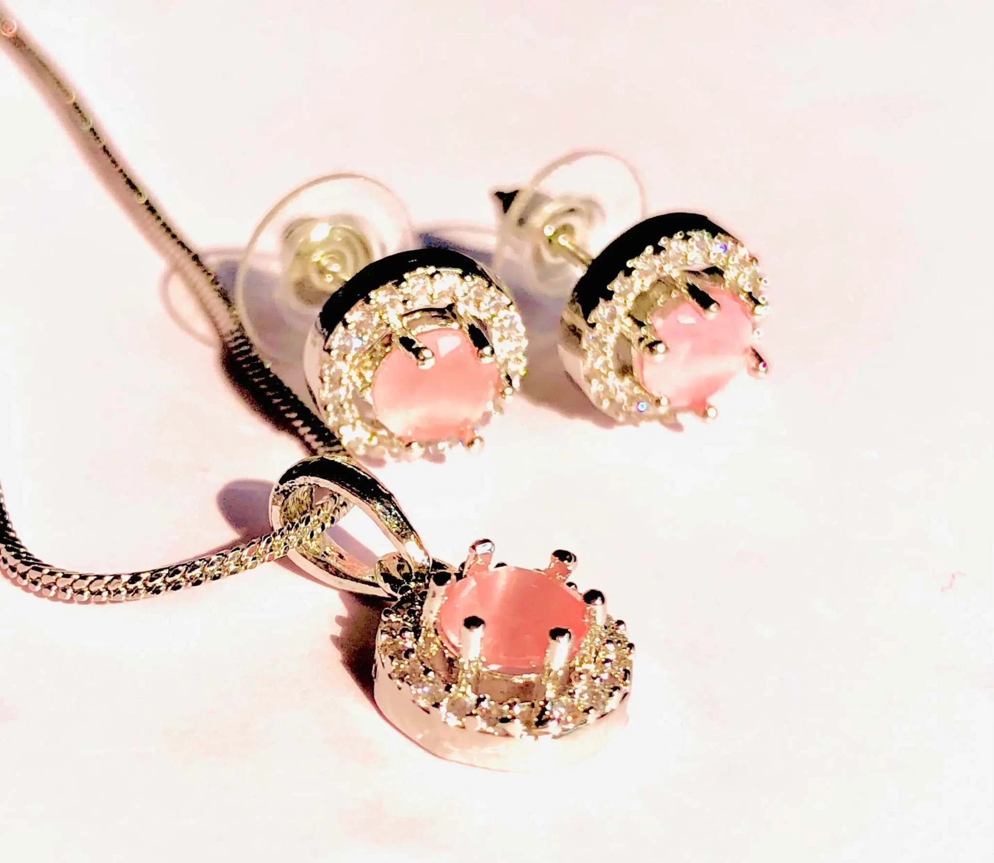 Charming baby pink silver earrings and pendant set with round pink stones and sparkling silver accents