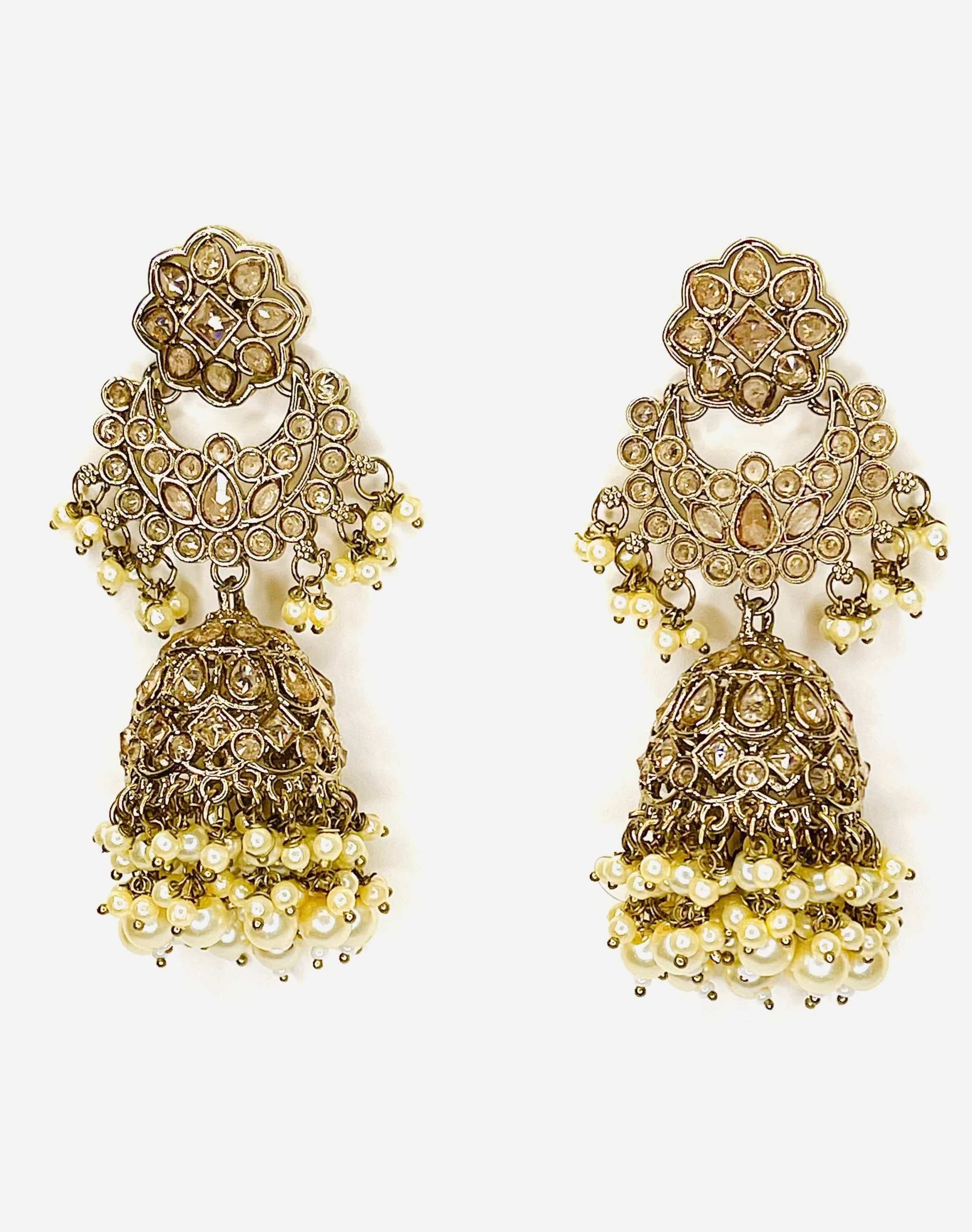Cascading long jhumkas with tiered gold design and pearl details for elegant traditional wear
