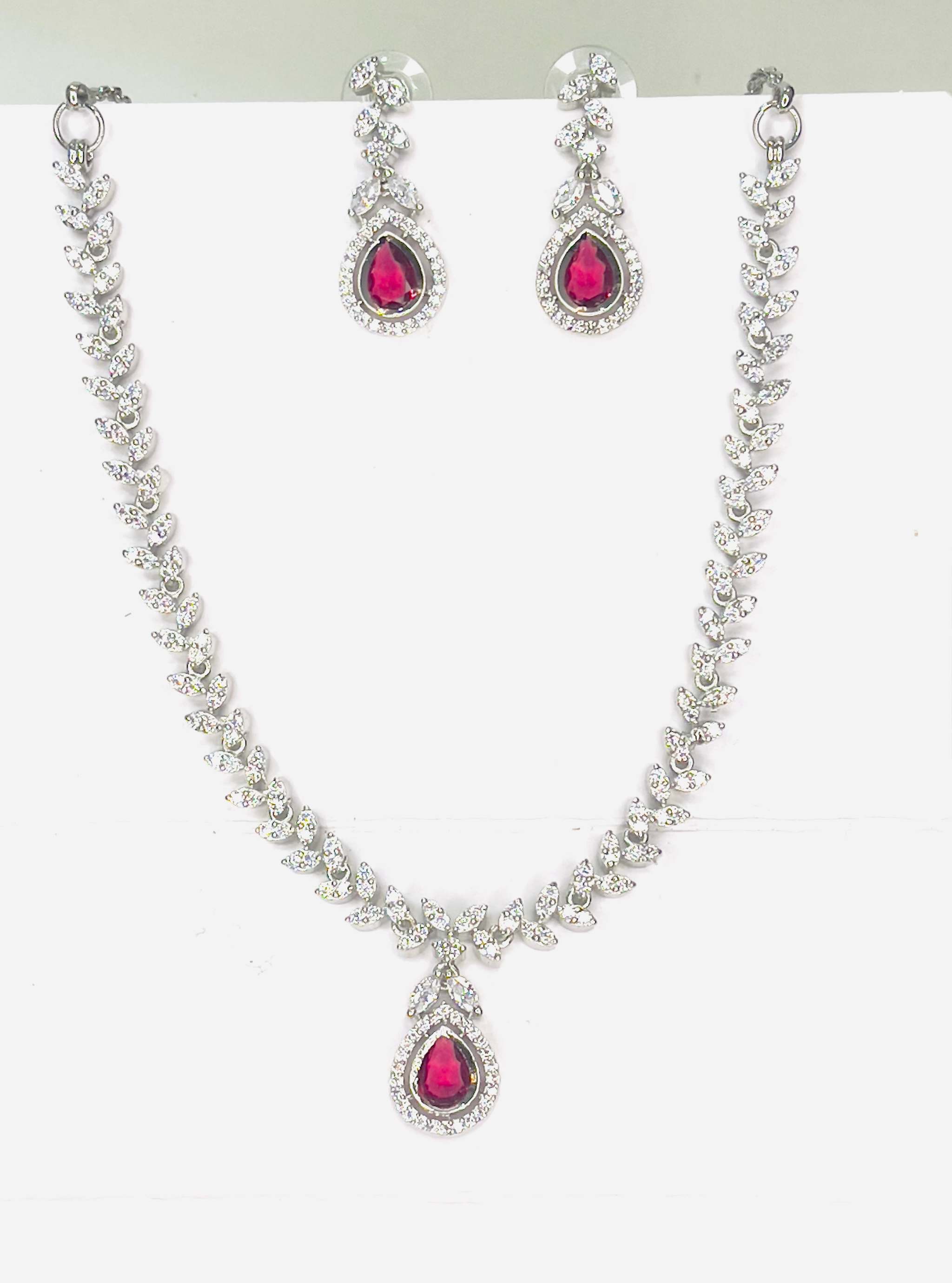 Scarlet Dew Necklace set in silver with bold scarlet teardrops and sparkling accents