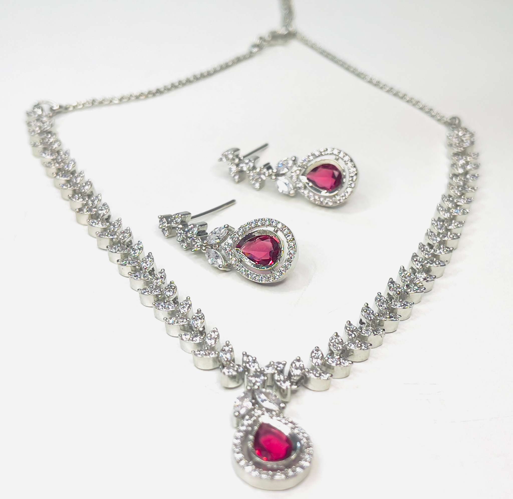 Scarlet Dew Necklace set in silver with bold scarlet teardrop stones and sparkling accents