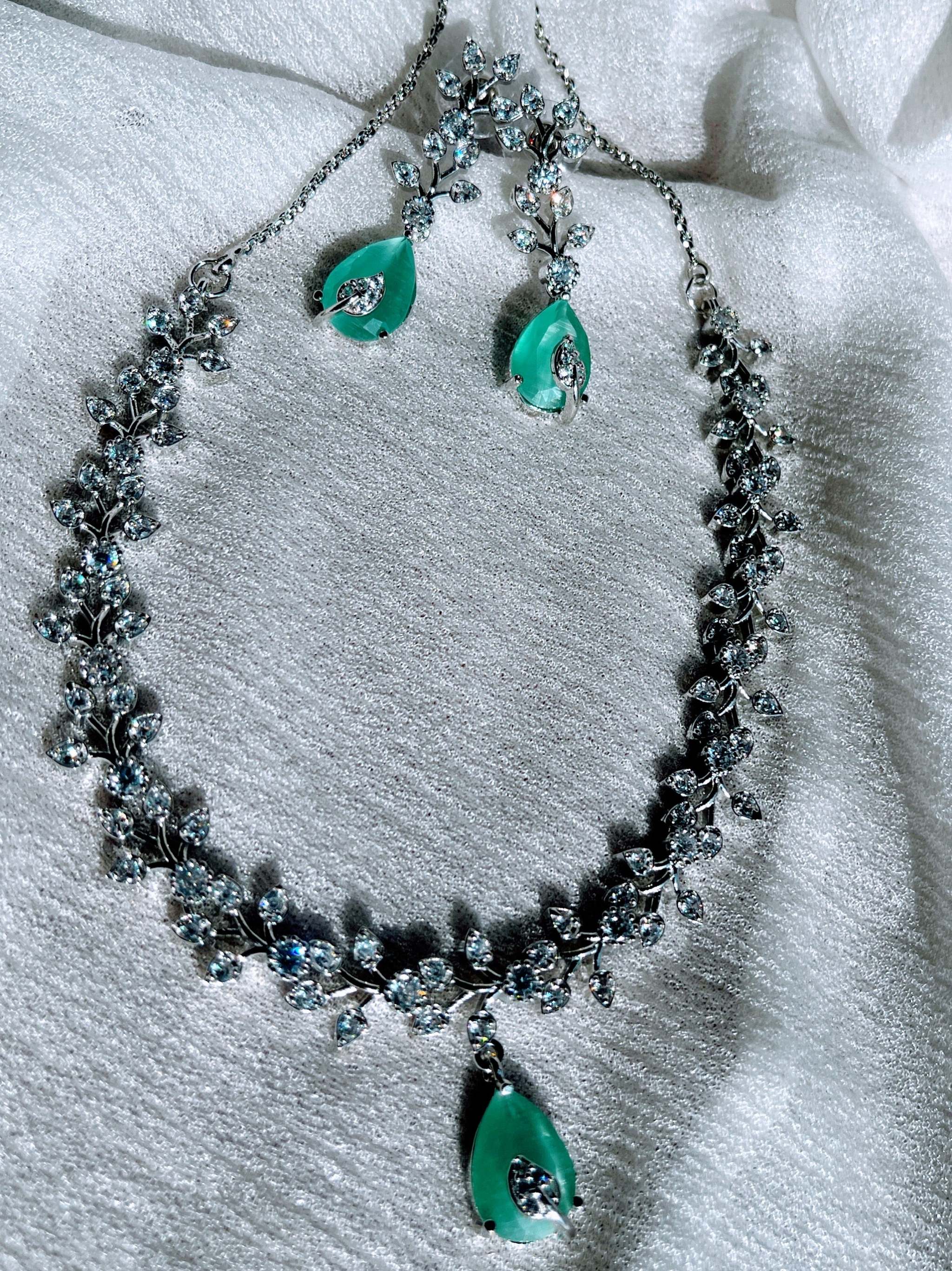 Aqua Boom Amora Necklace Set in silver with aqua blue teardrop pendants and sparkling crystal accents