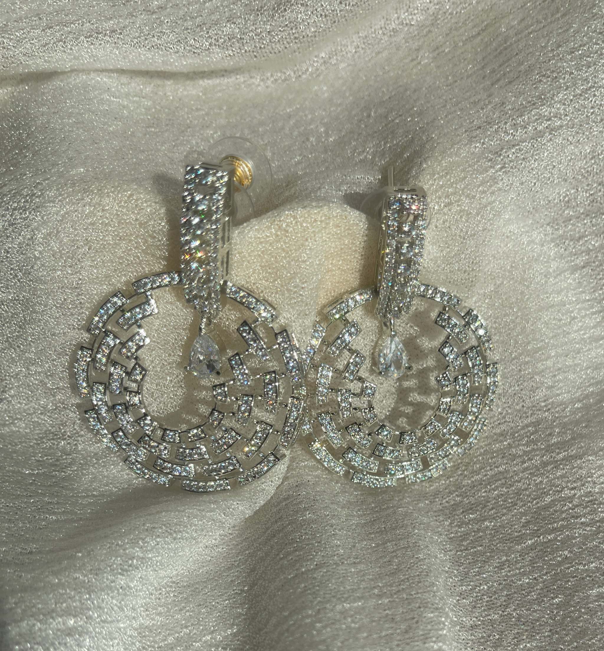 Silver Celestial Maze Danglers earrings with intricate cosmic geometric design and shimmering crystals