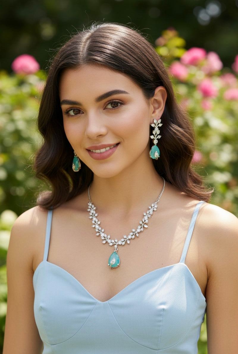 Aqua Boom Amora Necklace Set in silver with aqua tones and sparkling accents worn by woman