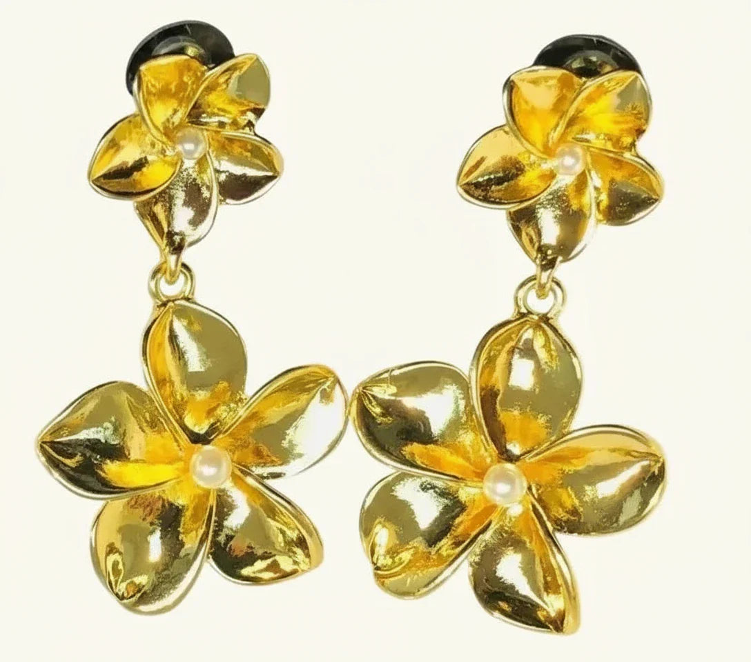 Golden floral dangling earrings with twin flower design and pearl center