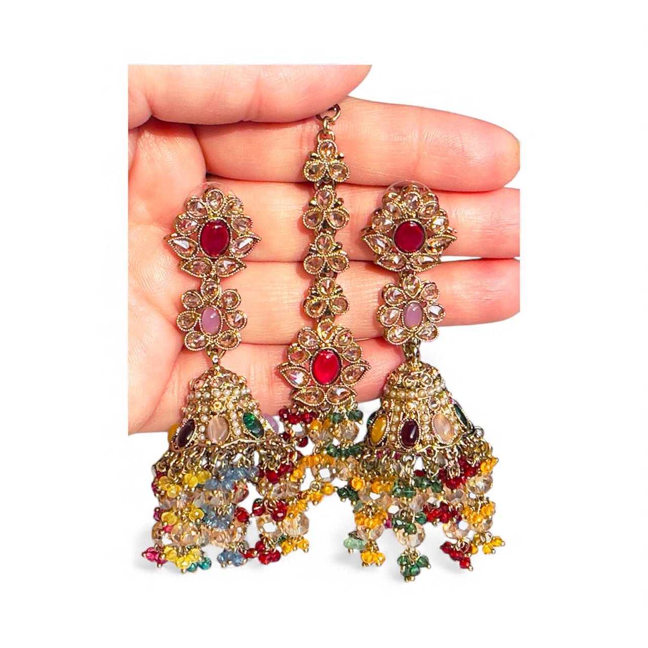 hand holding colorful Satrangi Jhilmil Bahaar Jhumka traditional earrings with multicolored stones and detailed craftsmanship