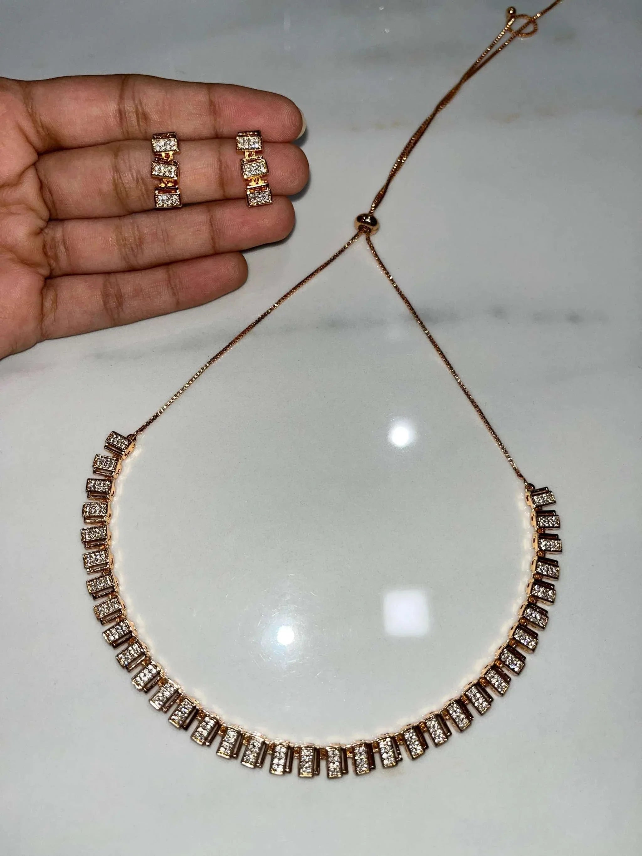 Classic rose gold zircon necklace and matching earrings set with elegant rectangular stones for timeless style