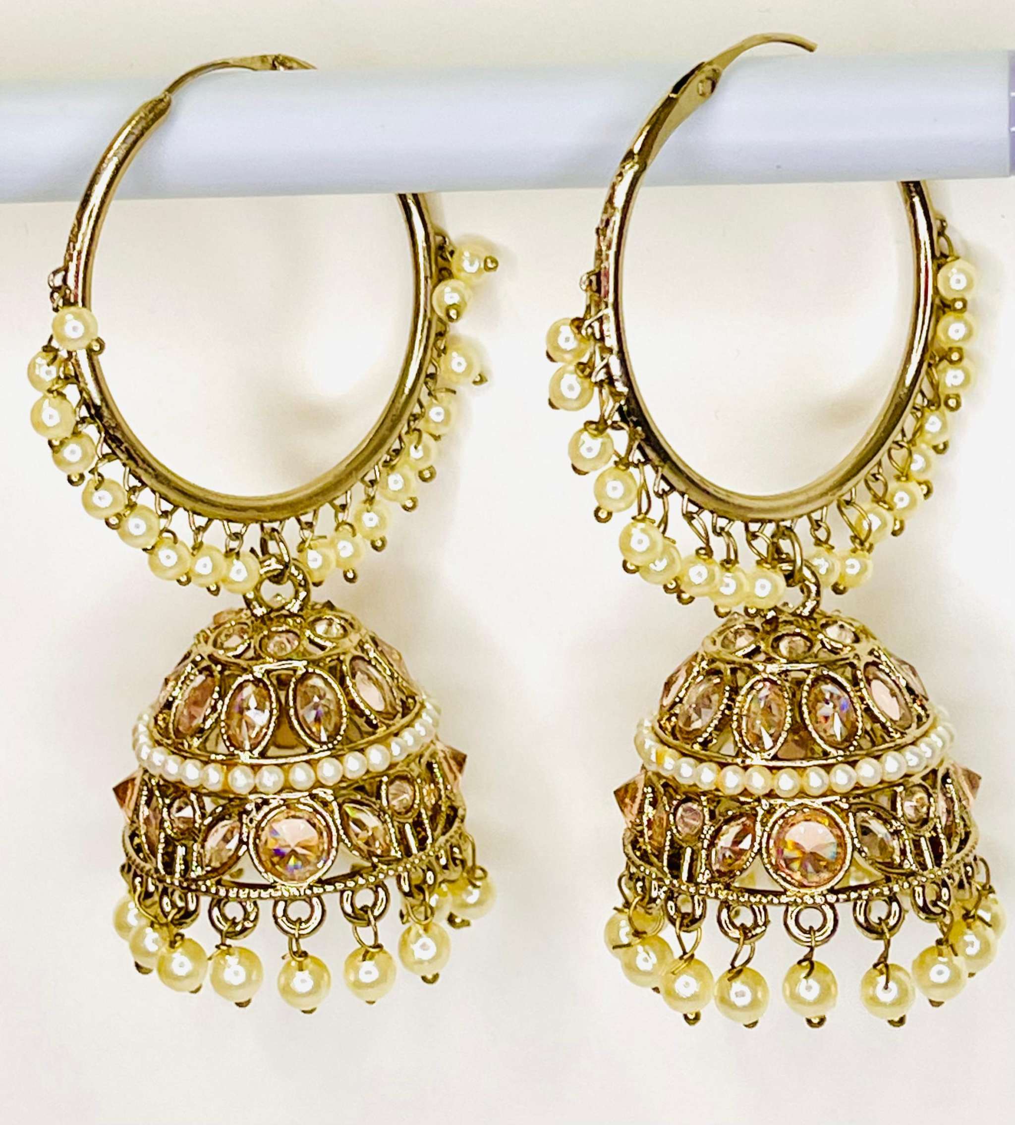 Gold Moti Jhumka earrings with intricate crescent moon design and pearl embellishments