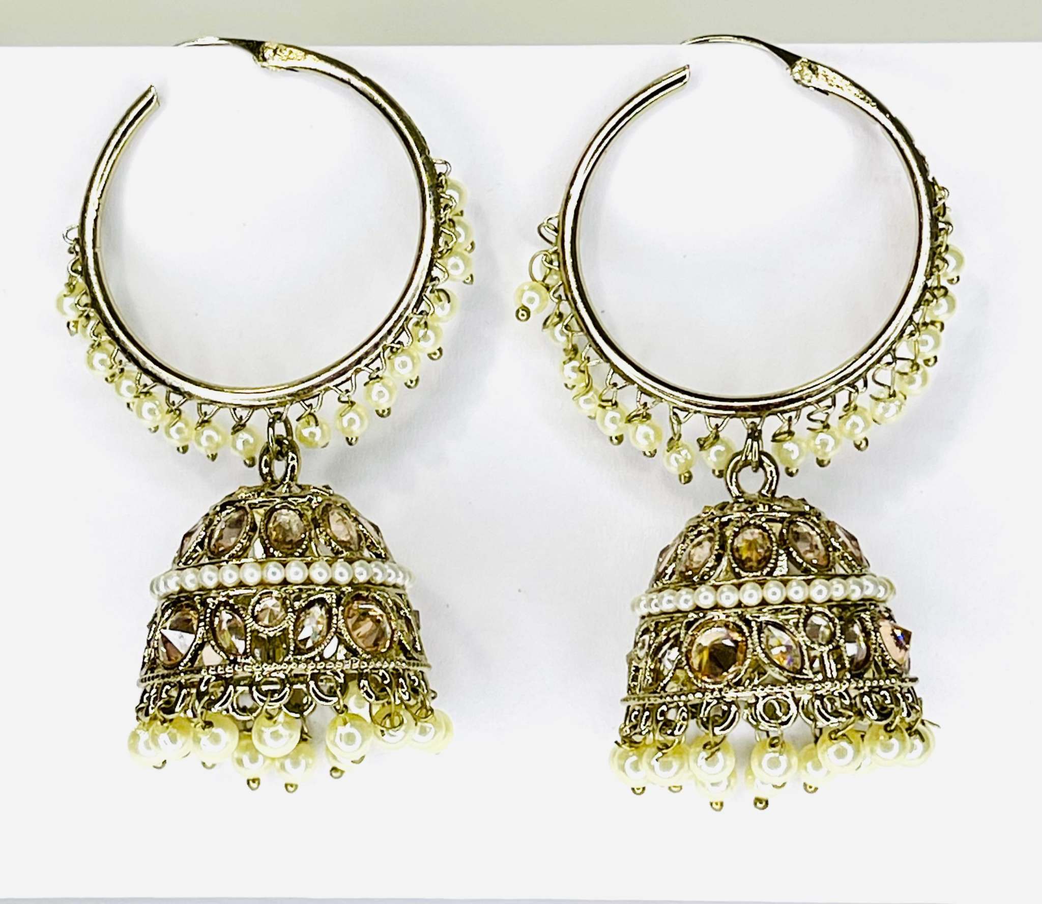 Pair of Moti Jhumka earrings with intricate crescent moon design and pearl embellishments